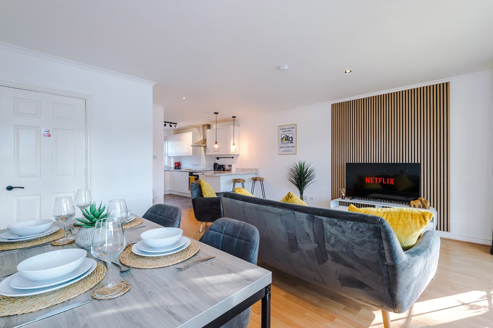 Open-plan living and dining space in an MJ3-managed short-let apartment, professionally styled and guest-ready
